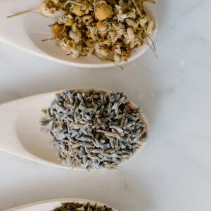 wooden spoons with dried herbs